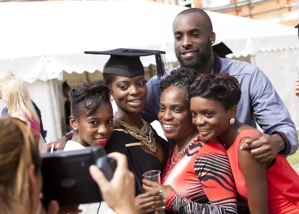 Graduate and her family posing for a photo