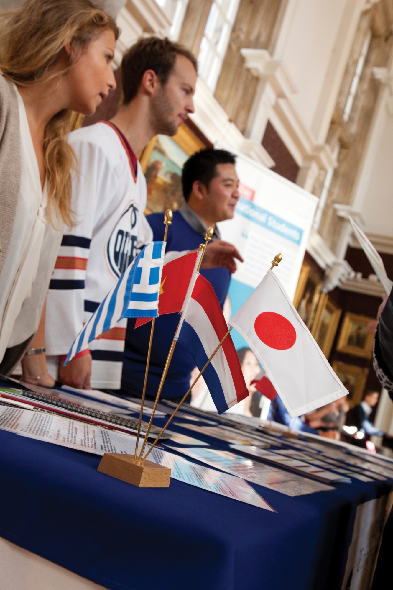 Flags on a table in the Picture Gallery during a welcome event