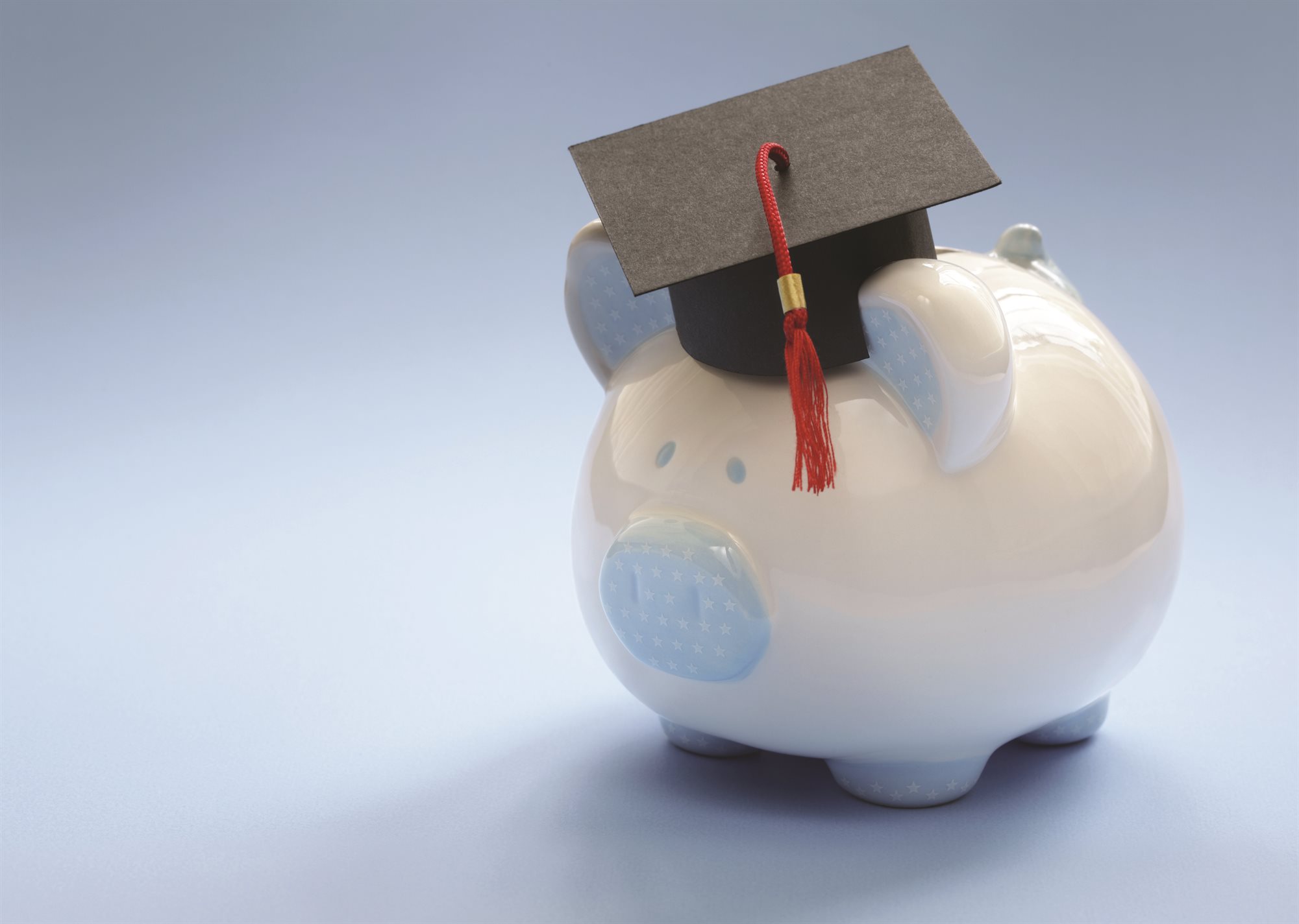 Piggy bank with mortar board hat on top