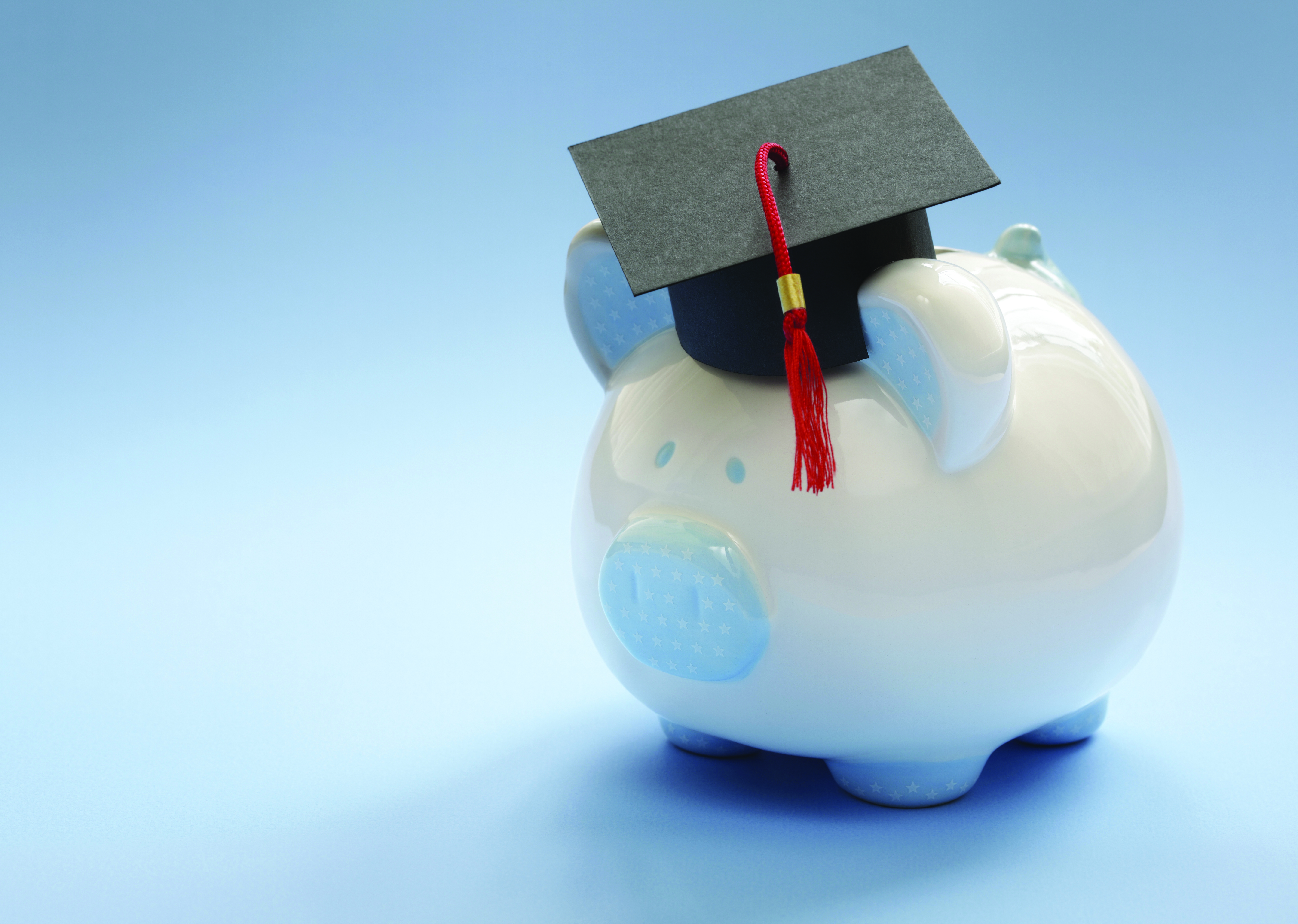 Piggy bank with mortar board hat on top